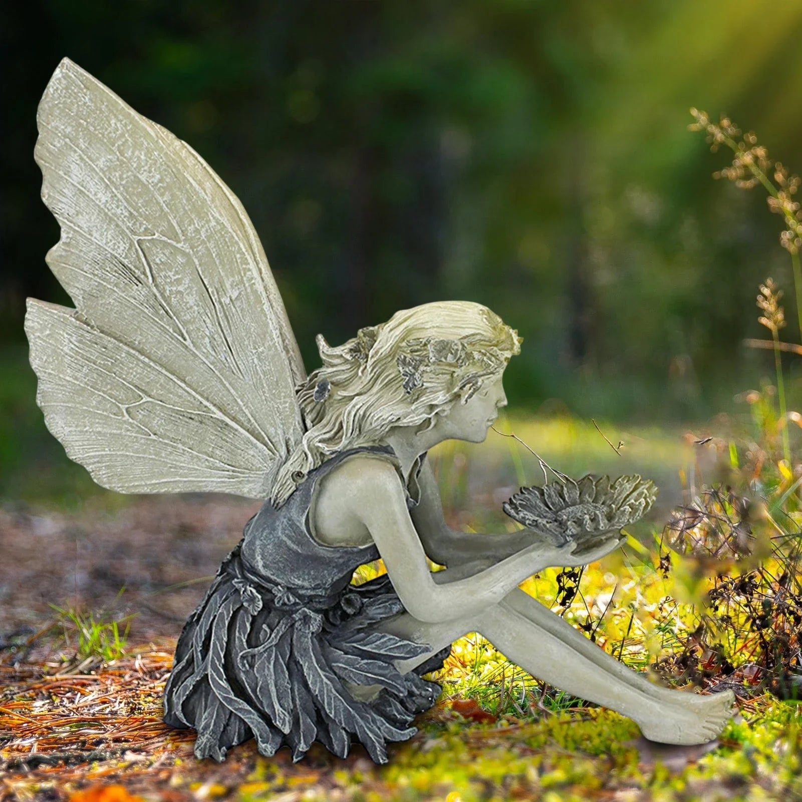 Beautifully detailed fairy statue with flower crown and petal skirt, holding a sunflower bowl in a garden setting