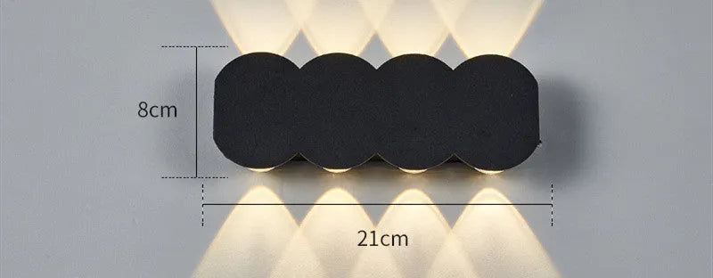 Modern square minimalist waterproof LED wall light mounted on an exterior wall.