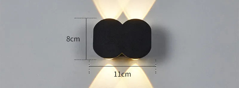 Modern square minimalist waterproof LED wall light mounted on an exterior wall.