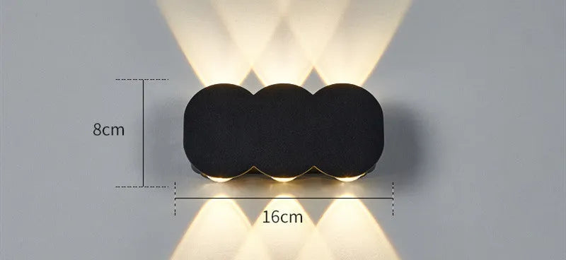 Modern square minimalist waterproof LED wall light mounted on an exterior wall.