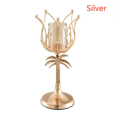 Iron candle holder in gold or silver finish on a dining table.