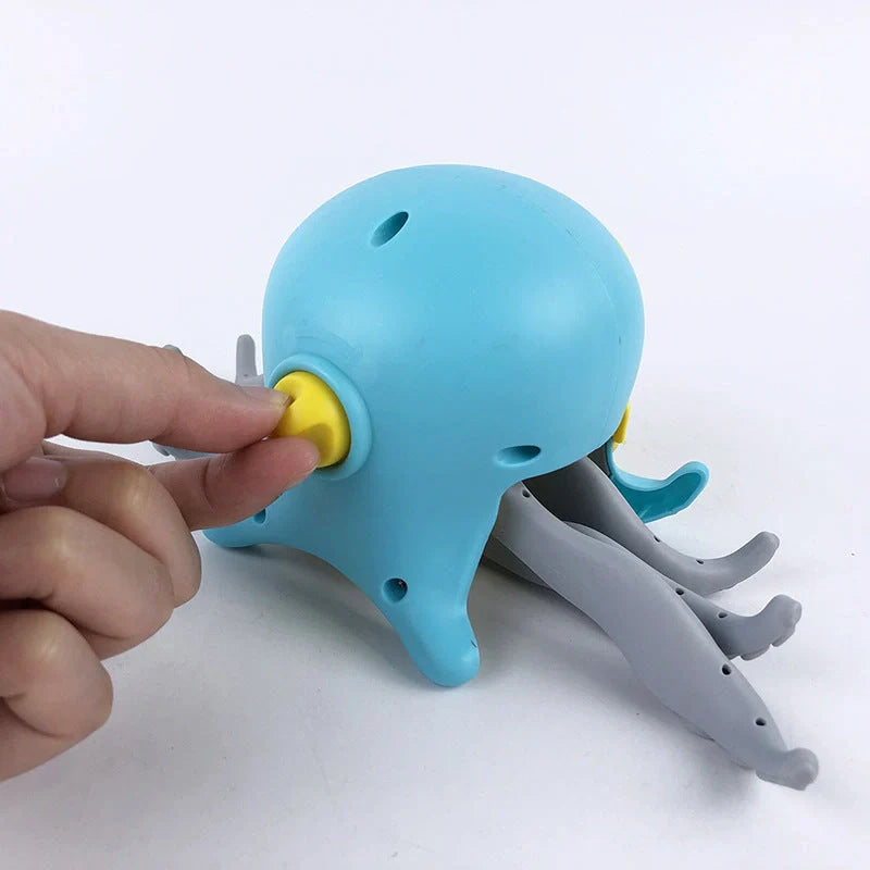 Floating octopus toy in purple and blue with six-leg linkage design for bath and beach fun
