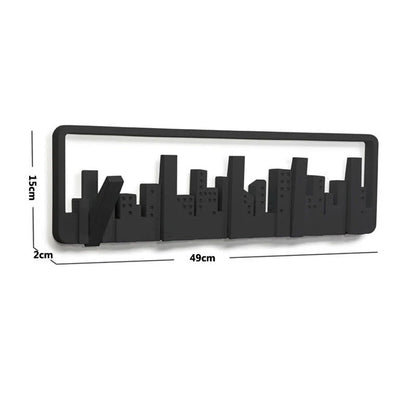 Wall-mounted coat rack with five flip-down hooks for organizing coats, hats, and other accessories