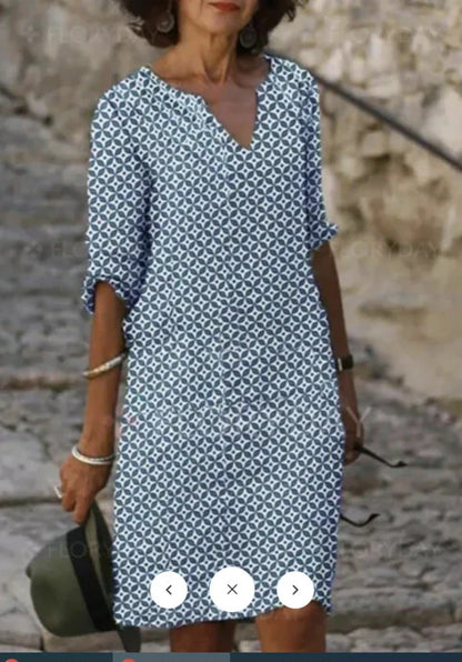 Vibrant mid-length dress with a colorful pattern, featuring a range of sizes and color options.