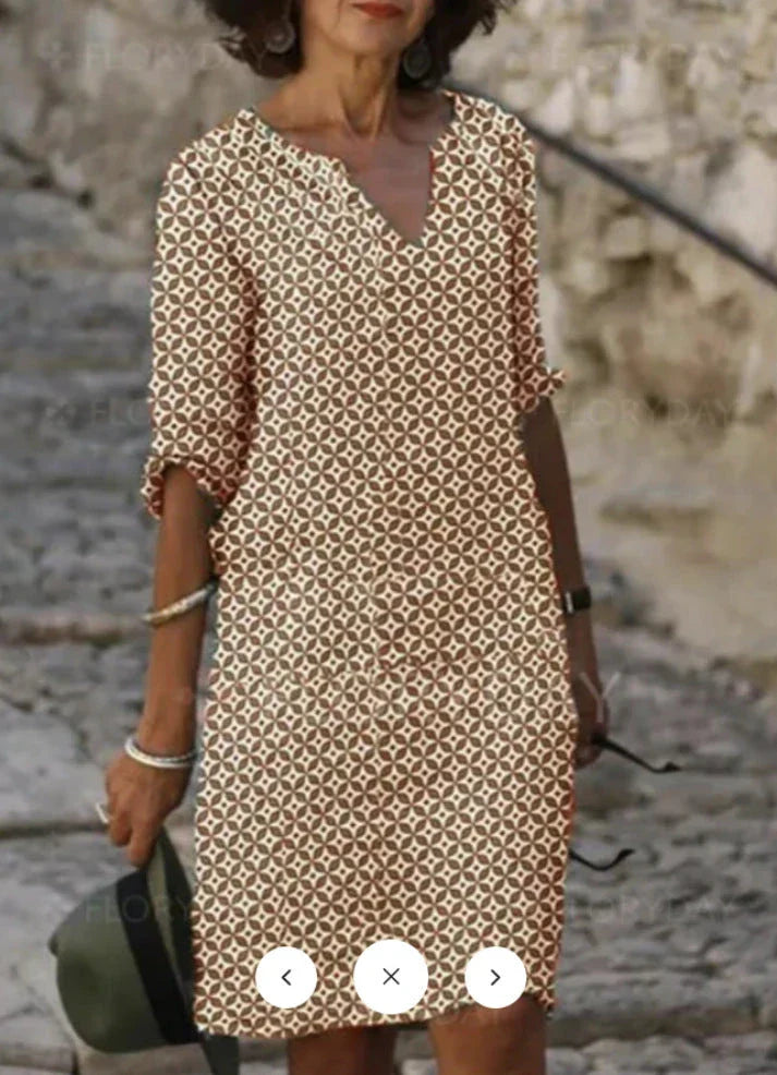 Vibrant mid-length dress with a colorful pattern, featuring a range of sizes and color options.