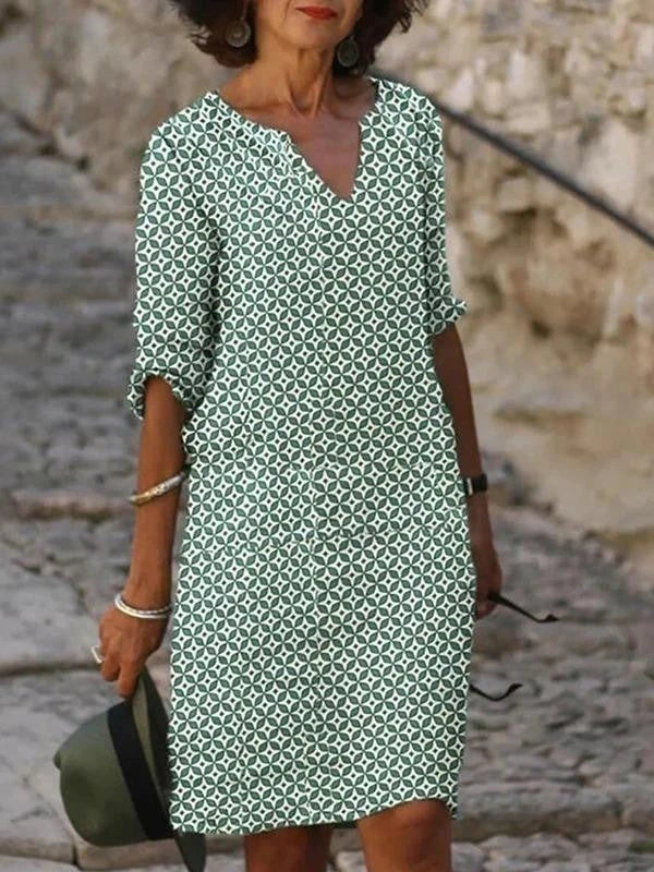Vibrant mid-length dress with a colorful pattern, featuring a range of sizes and color options.