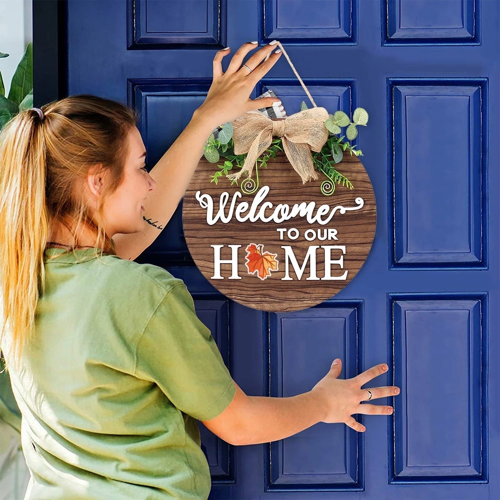 Rustic wooden door hanger with interchangeable seasonal plaques in a variety of holiday and home decor designs