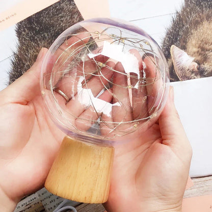 LED Crystal Ball Lamp with warm, magical lighting and elegant wooden base