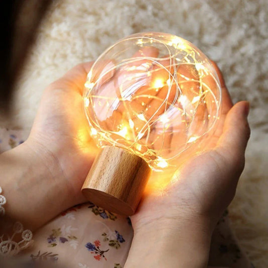 LED Crystal Ball Lamp with warm, magical lighting and elegant wooden base