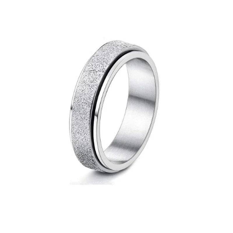 Rotatable stainless steel spinner ring with moon and star designs for anxiety relief and style