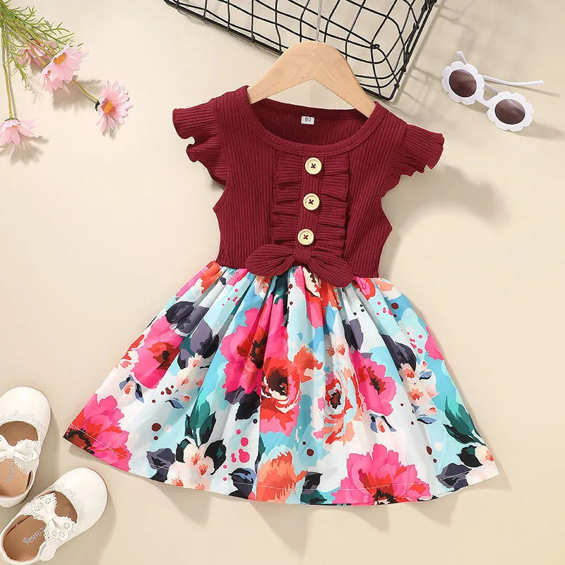 Sleeveless summer dress for toddler girl on a hanger, shown in one of six available colours.