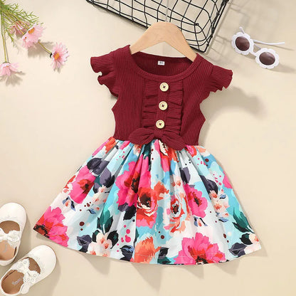Sleeveless summer dress for toddler girl on a hanger, shown in one of six available colours.