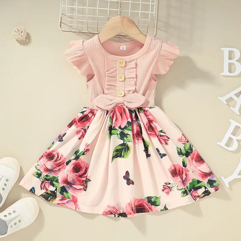 Sleeveless summer dress for toddler girl on a hanger, shown in one of six available colours.