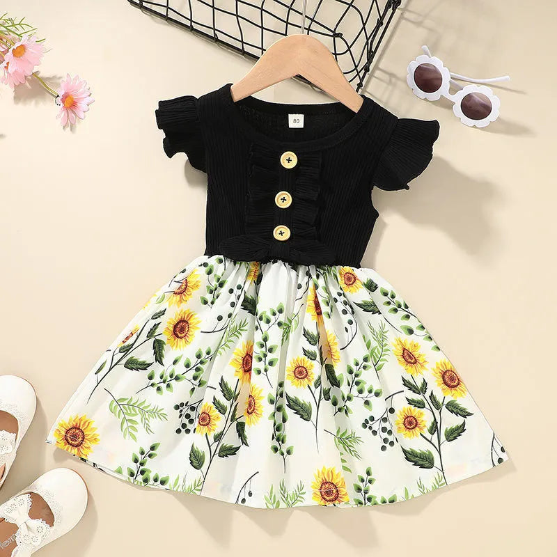 Sleeveless summer dress for toddler girl on a hanger, shown in one of six available colours.