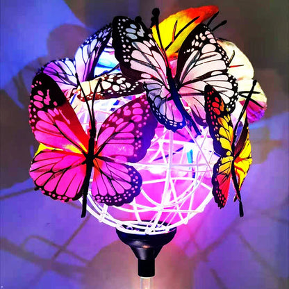 Elegant solar-powered butterfly garden lights with sleek black and transparent design, creating a captivating display in an outdoor setting