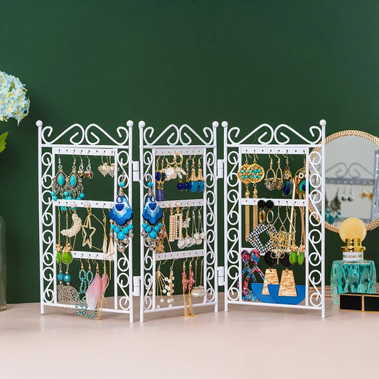 Premium metal jewelry display rack with European-inspired design, foldable for compact storage, and versatile earring and necklace organization.