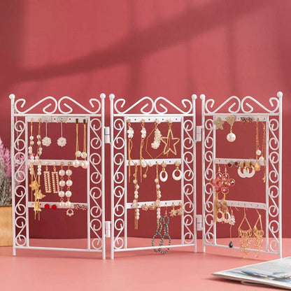 Premium metal jewelry display rack with European-inspired design, foldable for compact storage, and versatile earring and necklace organization.
