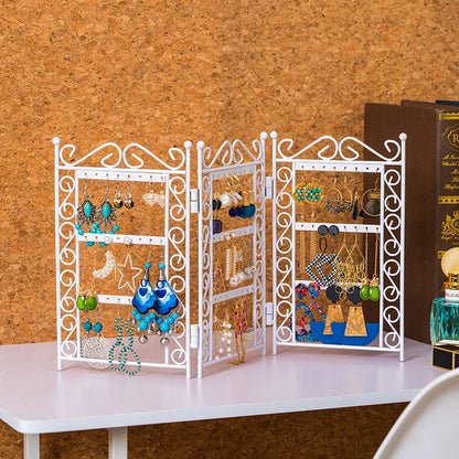 Premium metal jewelry display rack with European-inspired design, foldable for compact storage, and versatile earring and necklace organization.