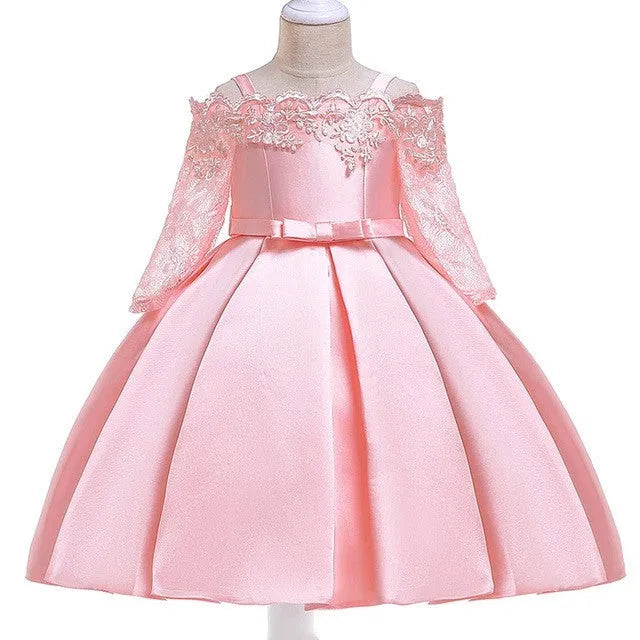 Simple children's polyester dress with lace trim in dark red, shown on a hanger.