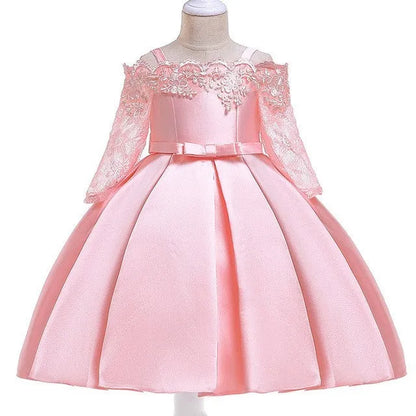 Simple children's polyester dress with lace trim in dark red, shown on a hanger.