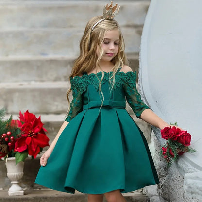 Simple children's polyester dress with lace trim in dark red, shown on a hanger.