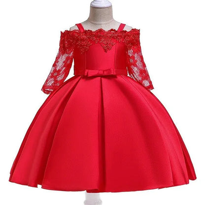 Simple children's polyester dress with lace trim in dark red, shown on a hanger.