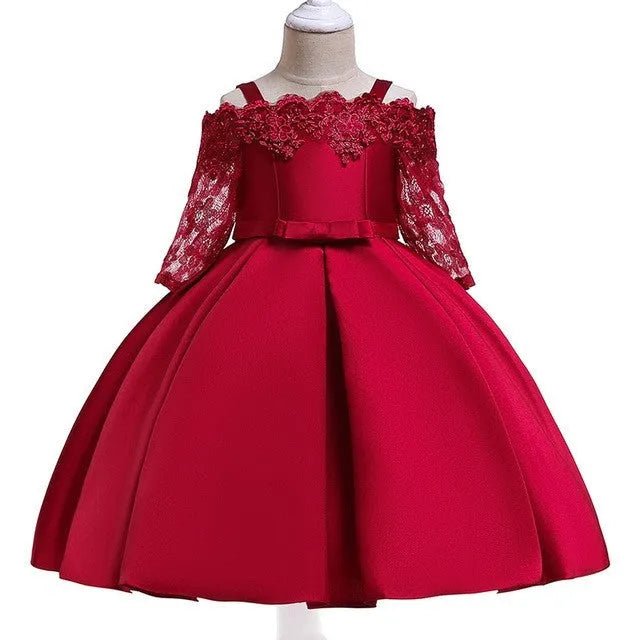 Simple children's polyester dress with lace trim in dark red, shown on a hanger.