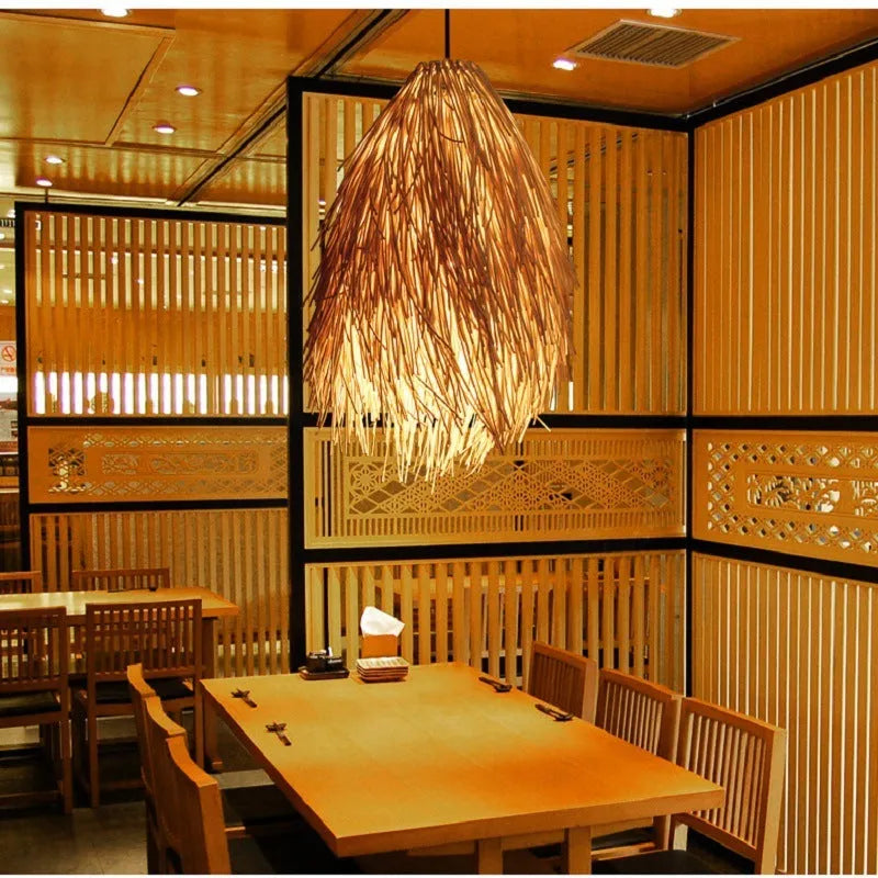 Rattan chandelier with pine cone decorative elements hanging on adjustable fishing line