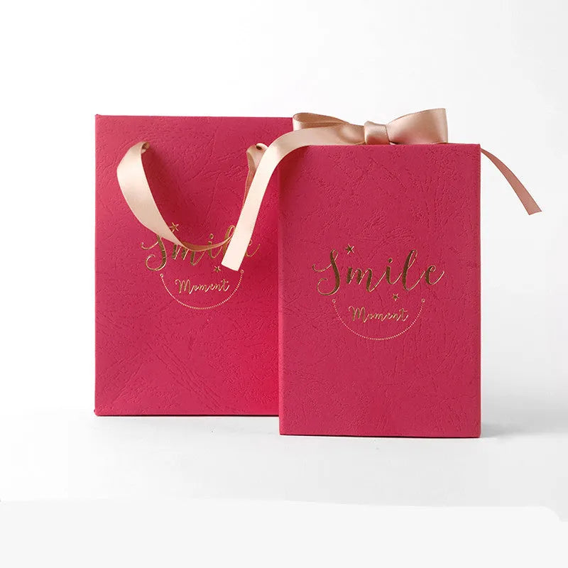 Small cardboard gift box with gold foil accents in blue, pink, red, or white with matching handbag and raffia