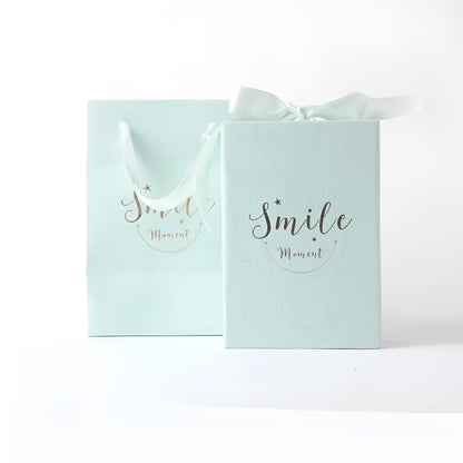 Small cardboard gift box with gold foil accents in blue, pink, red, or white with matching handbag and raffia