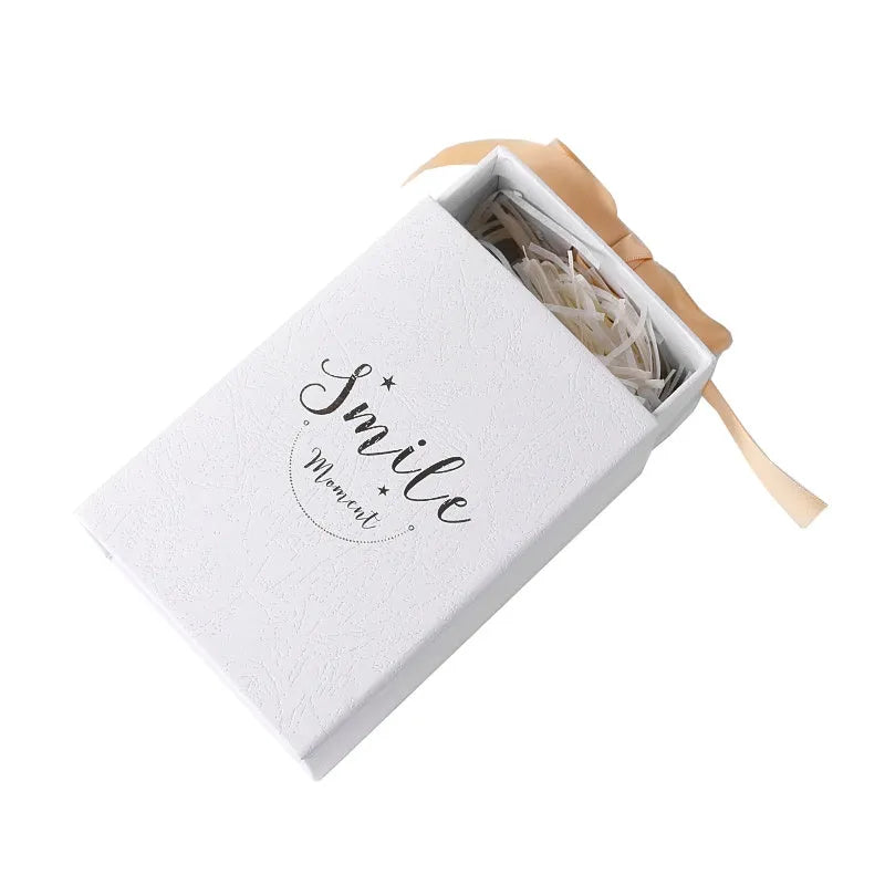 Small cardboard gift box with gold foil accents in blue, pink, red, or white with matching handbag and raffia