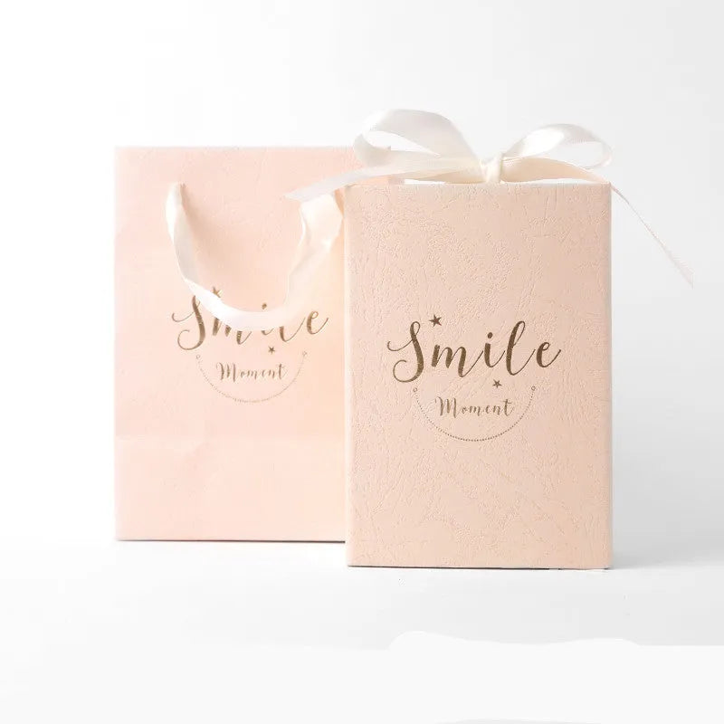 Small cardboard gift box with gold foil accents in blue, pink, red, or white with matching handbag and raffia