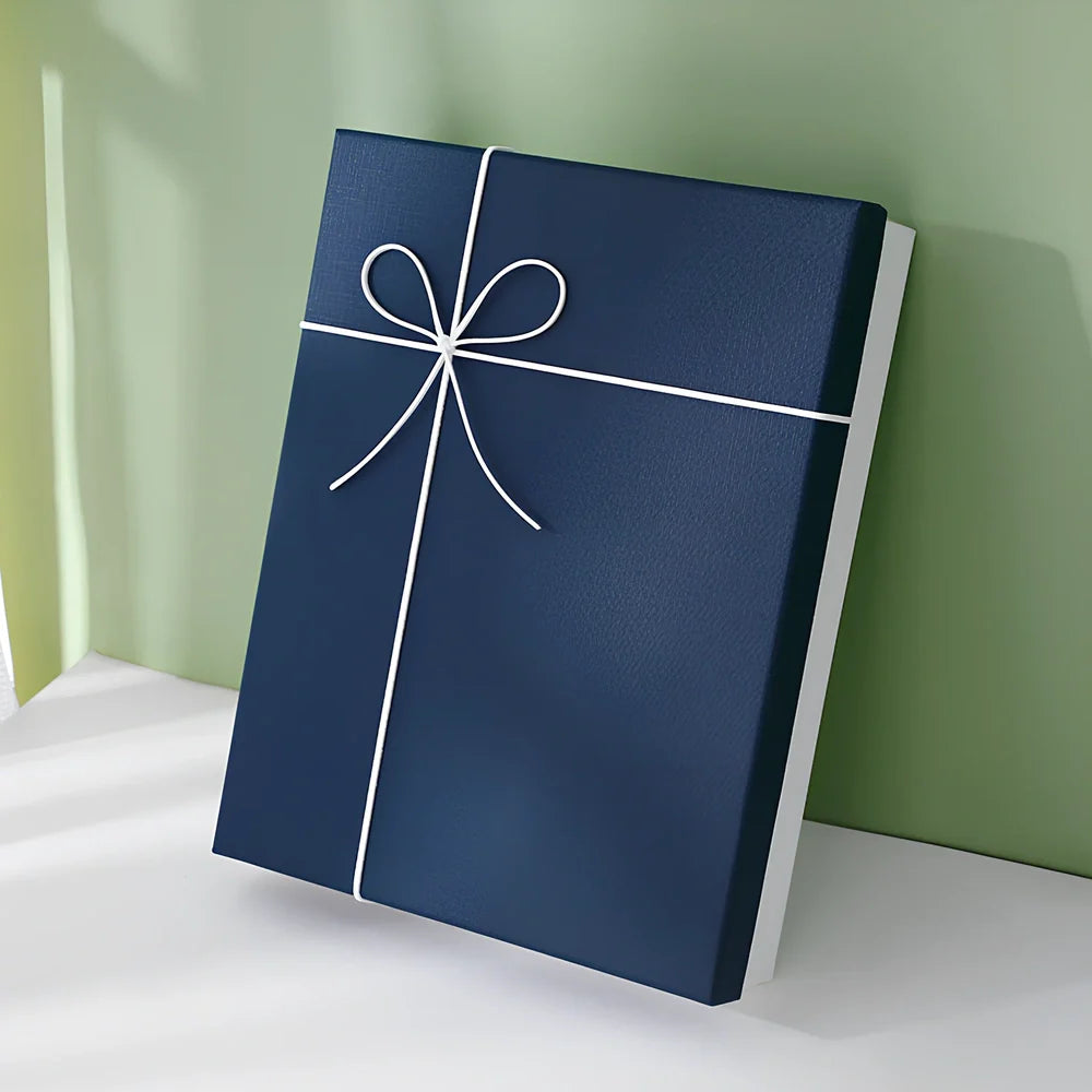Rectangular gift box showing thick cardboard construction with special paper covering in blue and white colour combination