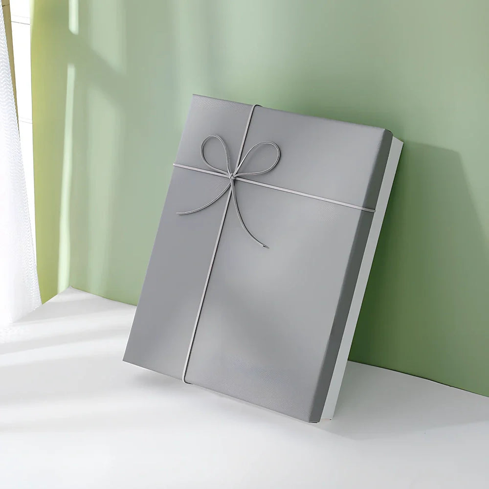 Rectangular gift box showing thick cardboard construction with special paper covering in blue and white colour combination