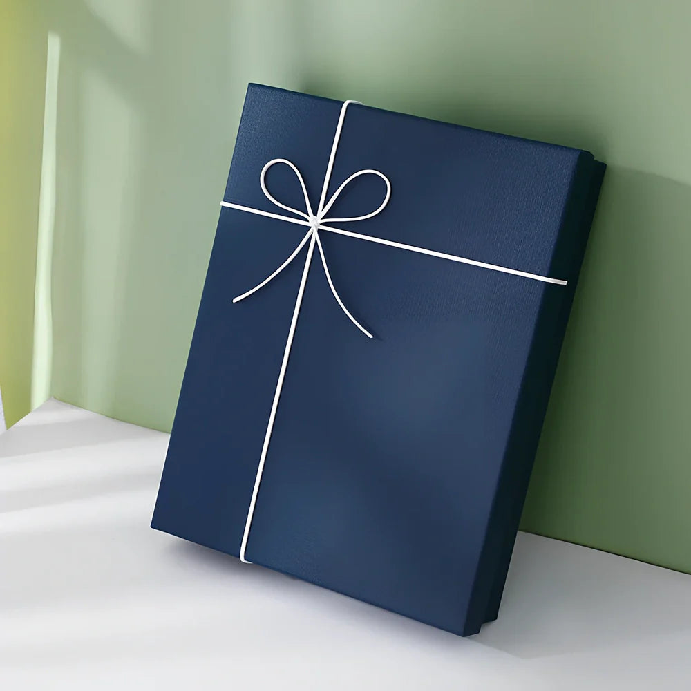 Rectangular gift box showing thick cardboard construction with special paper covering in blue and white colour combination