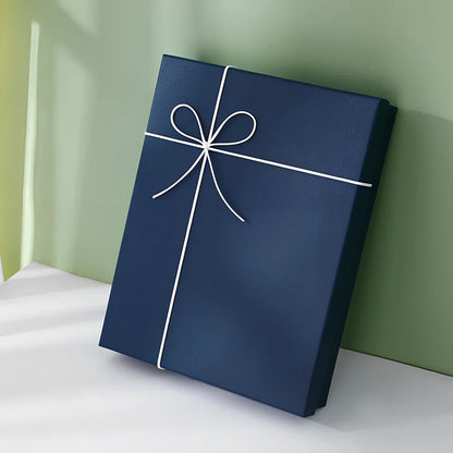 Rectangular gift box showing thick cardboard construction with special paper covering in blue and white colour combination