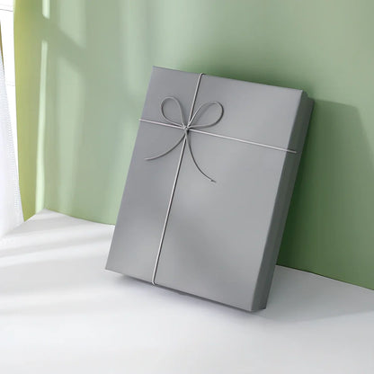 Rectangular gift box showing thick cardboard construction with special paper covering in blue and white colour combination