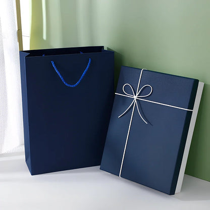 Rectangular gift box showing thick cardboard construction with special paper covering in blue and white colour combination