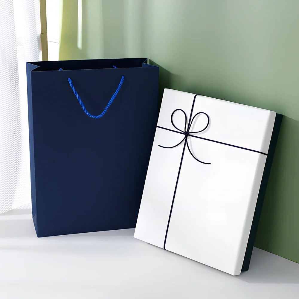 Rectangular gift box showing thick cardboard construction with special paper covering in blue and white colour combination