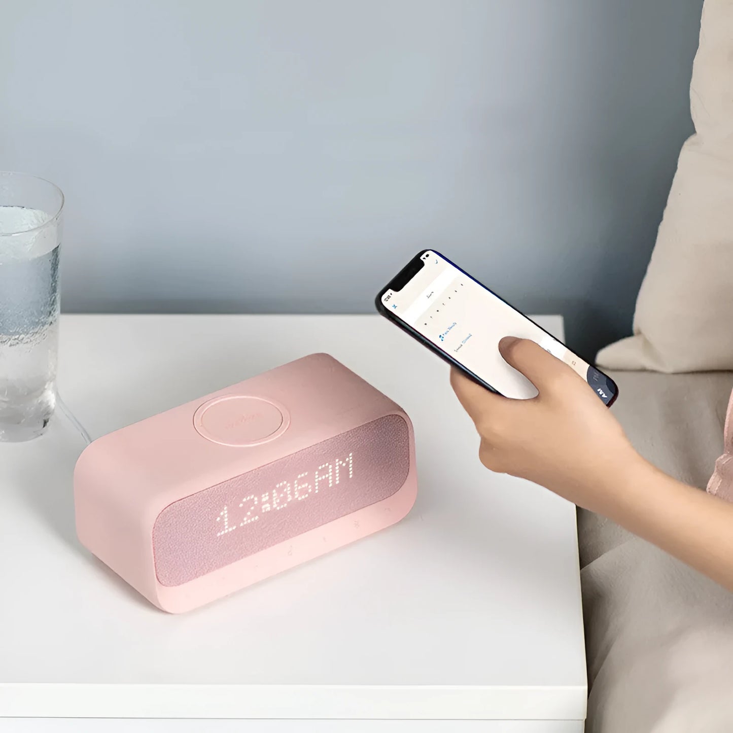 Anker Soundcore white Bluetooth speaker with wireless charging surface and display screen