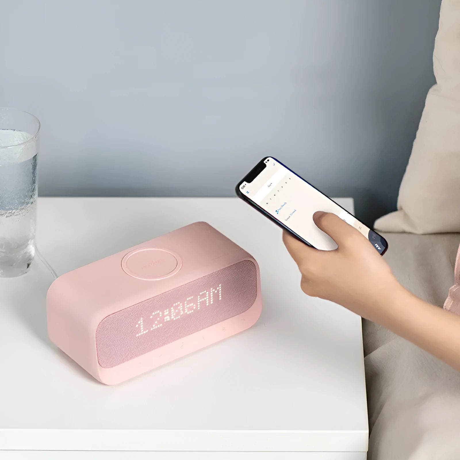 Anker Soundcore white Bluetooth speaker with wireless charging surface and display screen