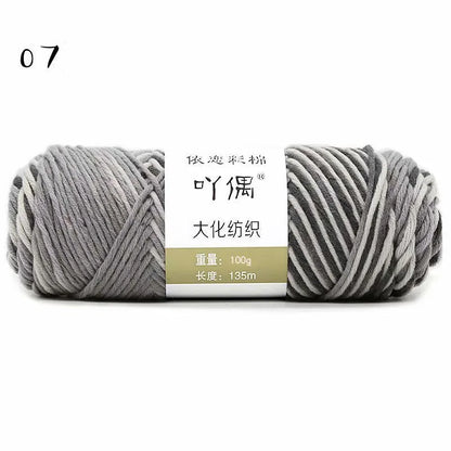 Eight strands of gradient milk cotton wool in a ball, showing multiple colour options for hand knitting.