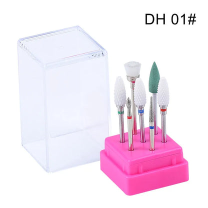Set of six tungsten steel nail drill bits and a brush in a clear plastic case.