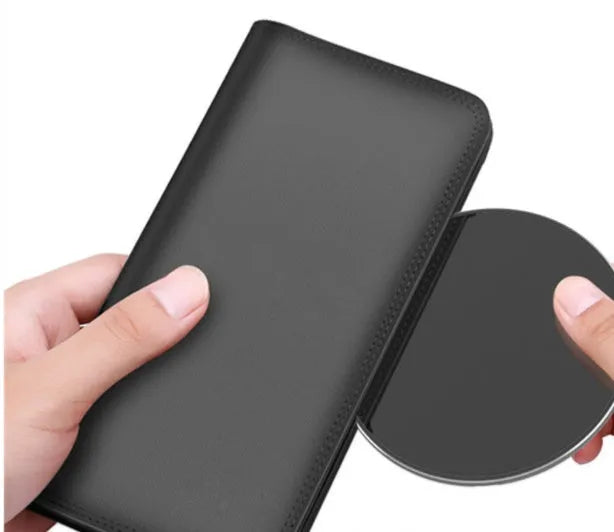 Ultra-thin aluminium alloy wireless charger compatible with Qi-enabled smartphones delivering 1500 mA charging current through a micro USB interface, featuring a charging status indicator and available in golden, red, rose gold, or silvery finishes.