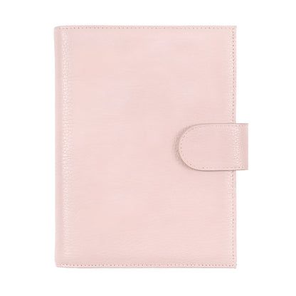 Close-up of a hand-embossed lychee pattern on an off-white A6 cowhide leather notebook with loose-leaf binding.