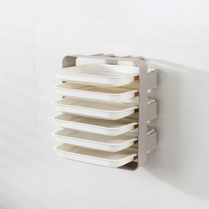 Wall-mounted kitchen shelf with stackable trays in navy blue, white, and coffee colour options