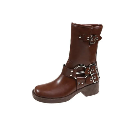 Women's black platform ankle boots with a silver buckle on the shaft, shown in a middle-calf length style.