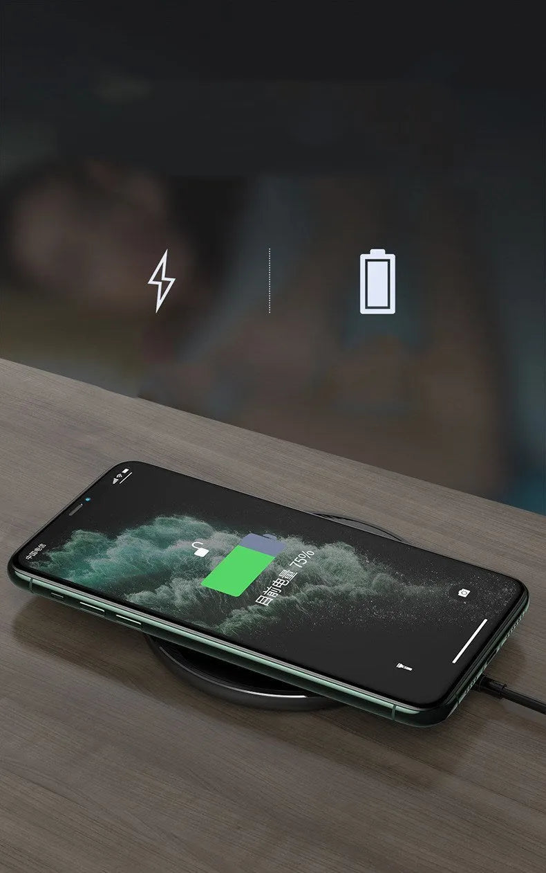 Black circular wireless charging disc for mobile phones with indicator light