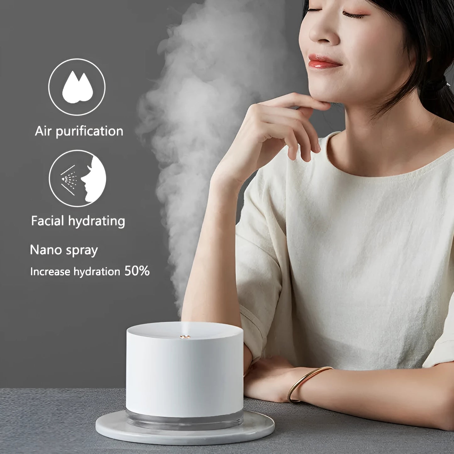 White portable ultrasonic humidifier with LED light and USB charging port on a wooden surface.