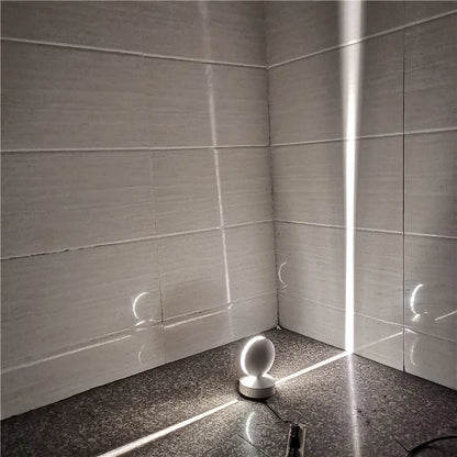Aluminium LED spotlight bar wall lamp with glass lens, shown in a corridor setting.
